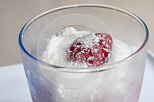 Ready to eat whipping cream with strawberry fruits in glass bowl