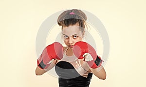 ready to fight. healthy lifestyle. energetic kids power. child punching in gym. knockout. small girl training in boxing