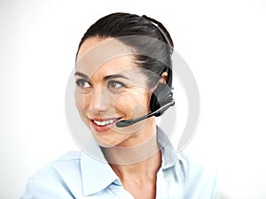 Ready to help. Attractive female customer service agent using a headset for client services.