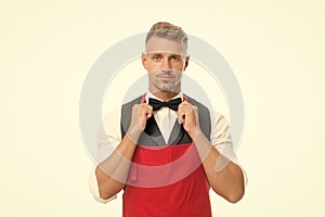 Ready to serve. Man cook hipster apron. Chef cook red apron white background. Bearded man waiter or servant. Restaurant