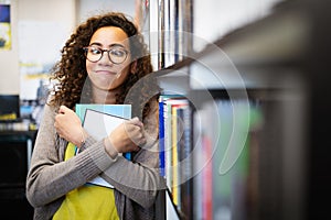 Ready to study hard. Happy nerd woman in library. Book lover.