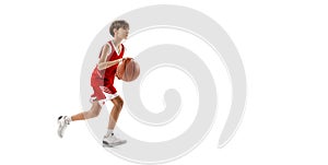 Full-length portrait of young boy, basketball player in motion, training isolated over white studio background. Flyer