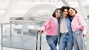 Ready For Trip. Three Happy Female Friends Posing At Airport Terminal