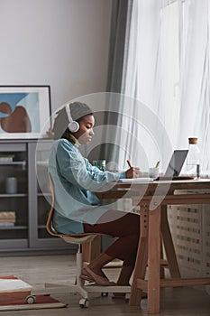 Real African American Woman Studying at Home