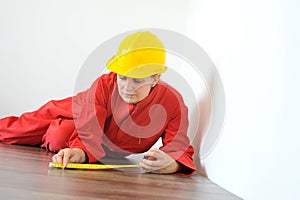 Real architect taking measures while planing house renovation