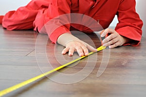 Real architect taking measures while planing house renovation