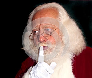 Real-bearded Santa saying Shhh!