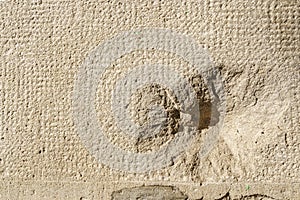 Real bullet and shrapnel holes from the Spanish civil war in a stone wall