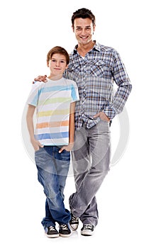 Real cool dudes...Full-length portrait of a father and son standing beside each other, isolated on white.