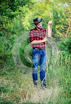 Real cowboys never run. western cowboy portrait. man checkered shirt on ranch. Vintage style man. Wild West retro cowboy