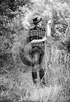 Real cowboys never run. western cowboy portrait. man checkered shirt on ranch. Vintage style man. Wild West retro cowboy