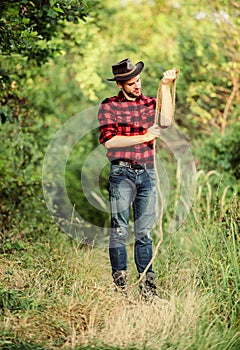 Real cowboys never run. western cowboy portrait. man checkered shirt on ranch. Vintage style man. Wild West retro cowboy