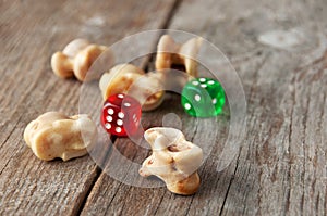 Real dice. Knuckle bones and gaming pieces. Ancient game with la