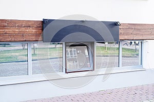 real establishment exterior with white walls , black logo for mockup design