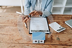 Real estate agent, African American businesswoman Africans use smartphone and calculators to offer mortgages to their