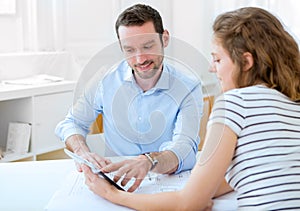 Real estate agent and customer at the office