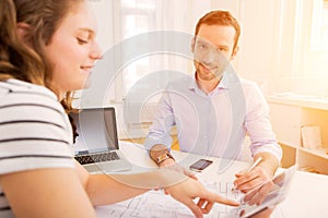 Real estate agent and customer at the office