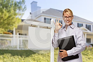 Real Estate Agent in Front of Blank Sign and House