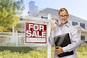 Real Estate Agent in Front of For Sale Sign, House