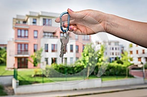 Real estate agent giving flat keys to a new property owner