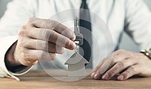 Real estate agent giving house key. Real estate concept