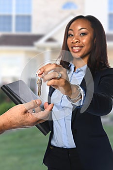 Real Estate Agent Handing Over Keys