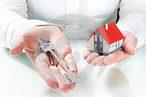 Real estate agent handing over keys to home