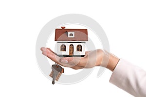 Real estate agent holding house model and key