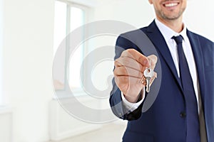 Real estate agent holding key