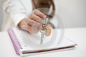 Real estate agent holding key photo