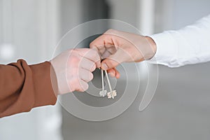 Real estate agent holding key and house model