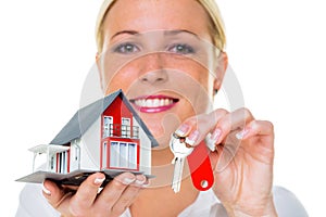 Real estate agent with house and key