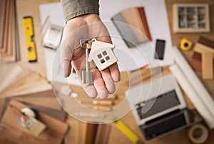 Real estate agent with house key photo