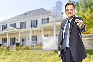 Real Estate Agent with House Keys in Front of Home