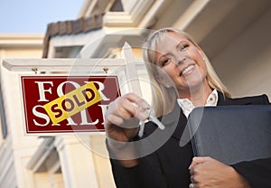 Real Estate Agent, Keys in Front of Sign and House