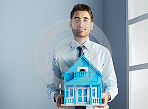 Real estate agent with model house