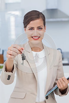 Real estate agent offering house key