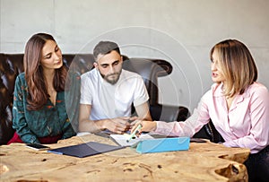 Real estate agent presenting a contract for house photo