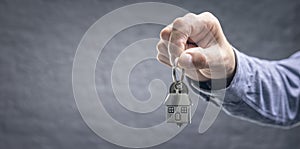Real estate agent property realtor or landlord giving house keys background