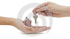 a real estate agent& x27;s hands holding keys and a house model against a pristine white background, symbolizing the