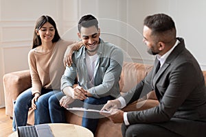 Real Estate Agent Showing Buyers Contract, Man Signing