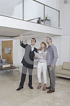 Real Estate Agent Showing Couple New Home