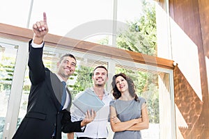 Real-estate agent showing couple new home