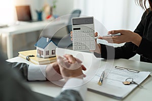 Real estate agent showing financial rate home loan for sign agreement customer the contract legally, Home sales and home