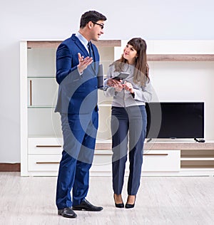 Real estate agent showing new apartment to owner photo