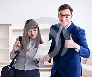 Real estate agent showing new apartment to owner