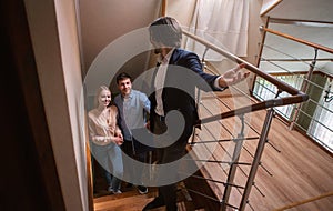 Real estate agent showing prospective buyers around property