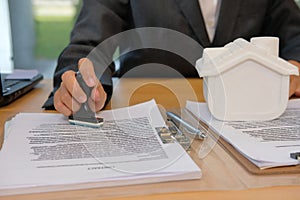 real estate agent stamping approved on mortgage loan contract ag