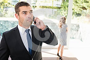 Real-estate agent talking on the mobile phone