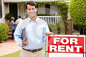 Real estate agent at work outside a property photo